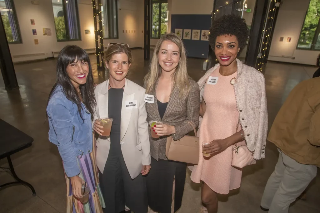 Group of 4 smiling women at civic center event